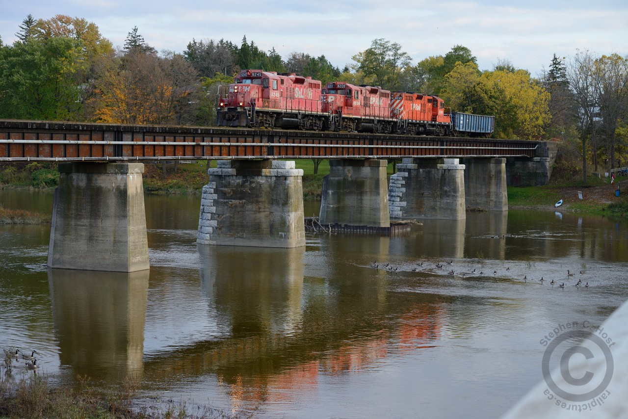 A heavy train crosses northward over the Grand River at the Freeport bridge on the former Grand River Railway enroute to the GEXR (CN) interchange. It's any wonder how long these three 8200 series GP9's will last with the GP20ECO invasion well under way.