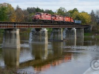 A heavy train crosses northward over the Grand River at the Freeport bridge on the former Grand River Railway enroute to the GEXR (CN) interchange. It's any wonder how long these three 8200 series GP9's will last with the GP20ECO invasion well under way. 