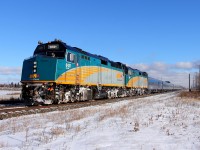 VIA's "Canadian" departs Winnipeg for Rivers and points west. Winter has finally arrived to this part of the prairies with the first snow fall one day earlier.