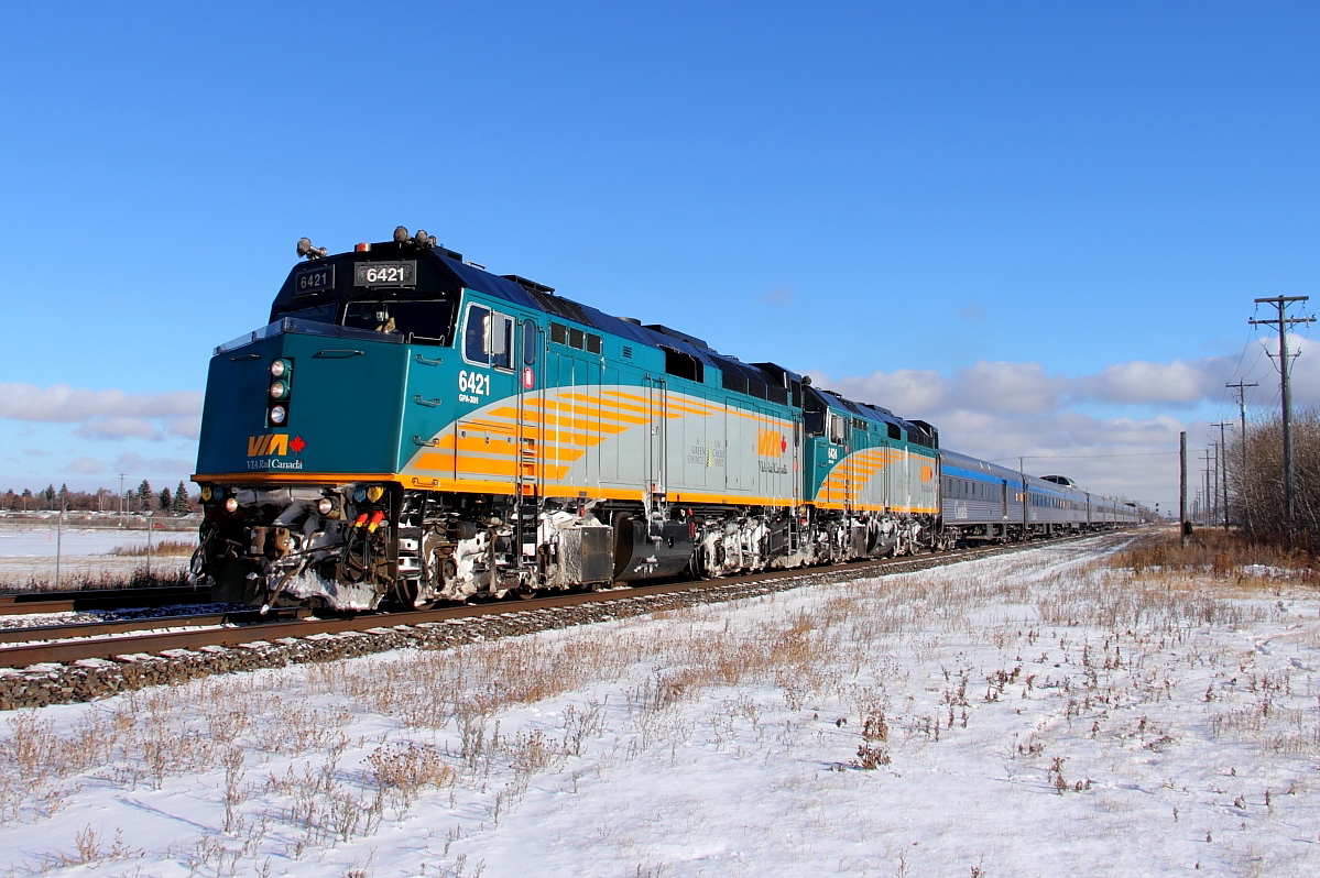 VIA's "Canadian" departs Winnipeg for Rivers and points west. Winter has finally arrived to this part of the prairies with the first snow fall one day earlier.