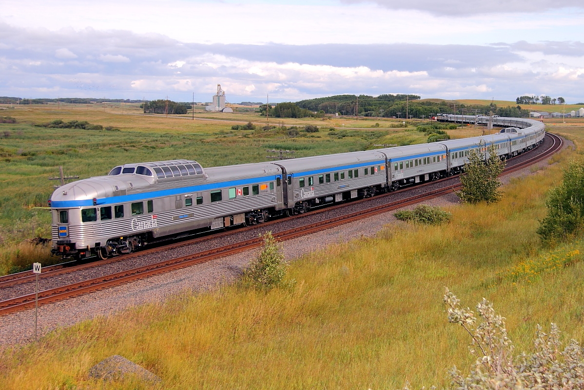 VIA's "Canadian" rounds the s curve at Arrow River as it heads for Rivers and points east.