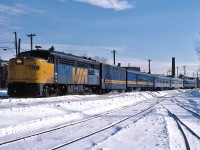 The Montreal section of VIA #1 'The Canadian' gets underway, snaking through Montreal on the first leg of its journey to Vancouver.  This short 4 coach train will be combined with the Toronto section of the Canadian at Sudbury.