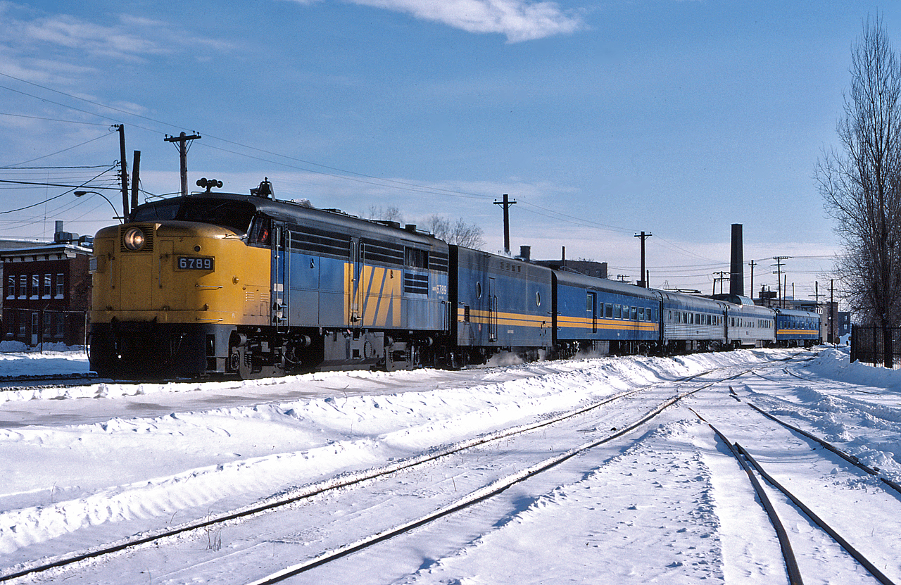 The Montreal section of VIA #1 'The Canadian' gets underway, snaking through Montreal on the first leg of its journey to Vancouver.  This short 4 coach train will be combined with the Toronto section of the Canadian at Sudbury.