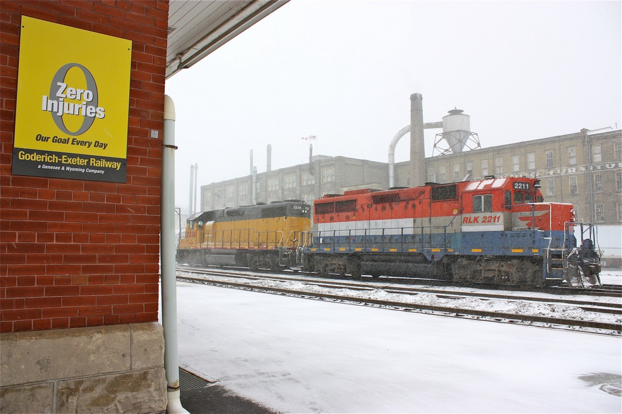 The winds of change are blowing hard and fast like the days lake effect snow squals over the Goderich - Exeter at Kitchener. Genesse Wyoming has wasted no time erasing RailAmerica's image as evident from the painted out RA markings on GP35 #2211 and the GW corporate colours on signage on the old station, not to mention the pair of GW painted units that have now arrived on the property. Orange, black and yellow will soon rule the rails here.