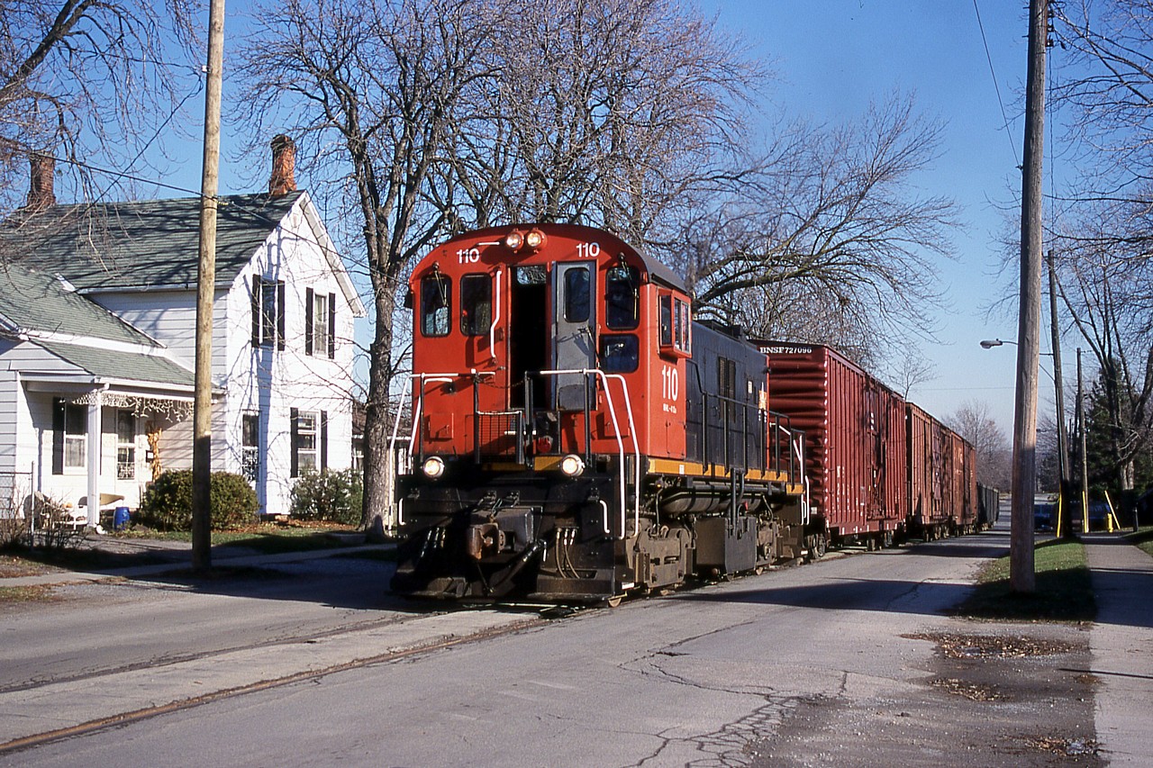 Inspired by Arnold's earlier photo and Steve's comment, here's a photo of the LAST street running in the Niagara region. TRRY 110 is seen trundling along Townline Road on their way to switch Interlake Paper. Unfortunately some knucklehead set fire to a wood trestle on the line and TRRY didn’t have the cash to repair it so the line was abandoned. I wonder if it would still be in service today if it weren’t for the vandalism?