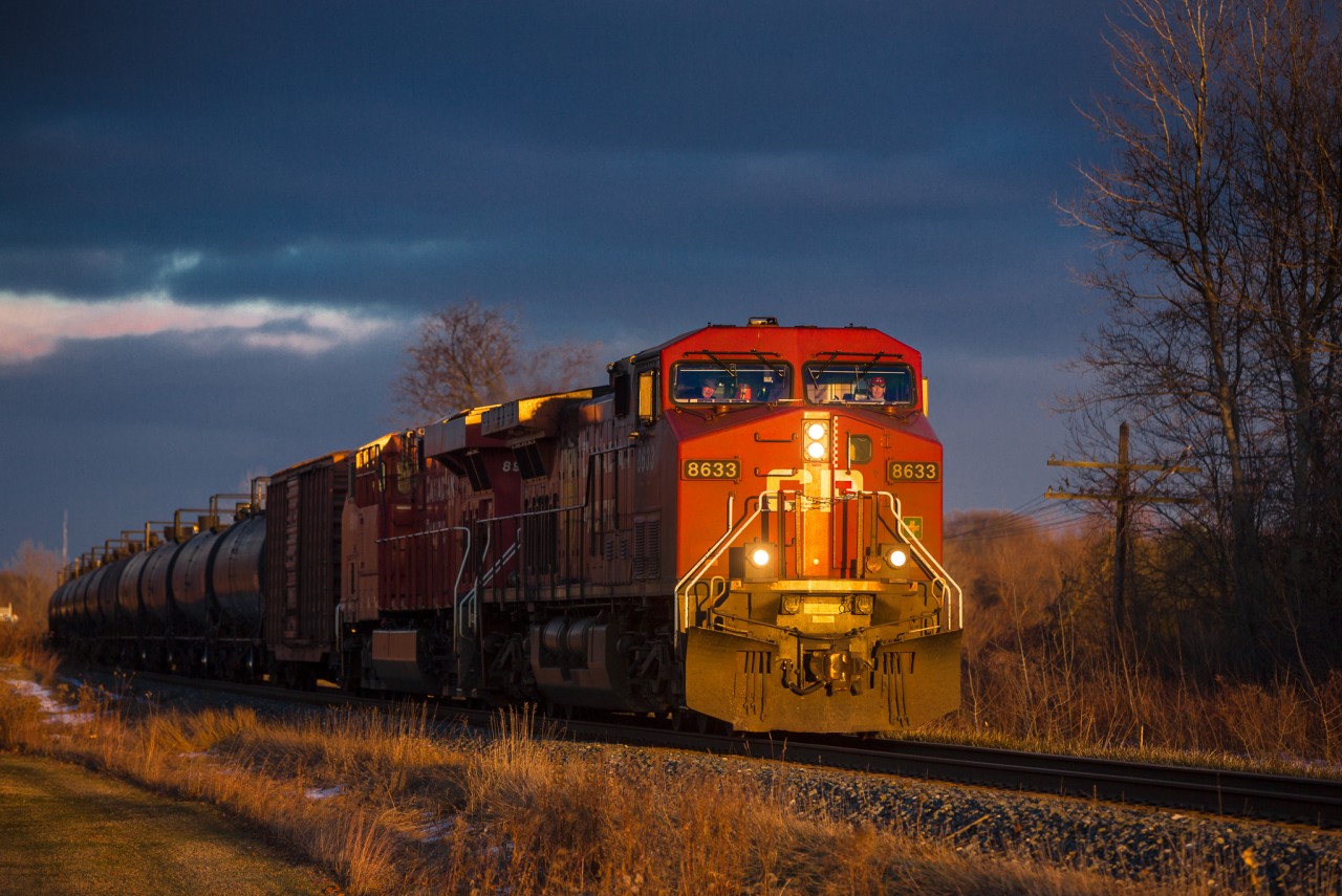CP 8633 CP 8911 Head into the the sunset as snow clouds brew in the background on the CP Windsor Sub MP 11