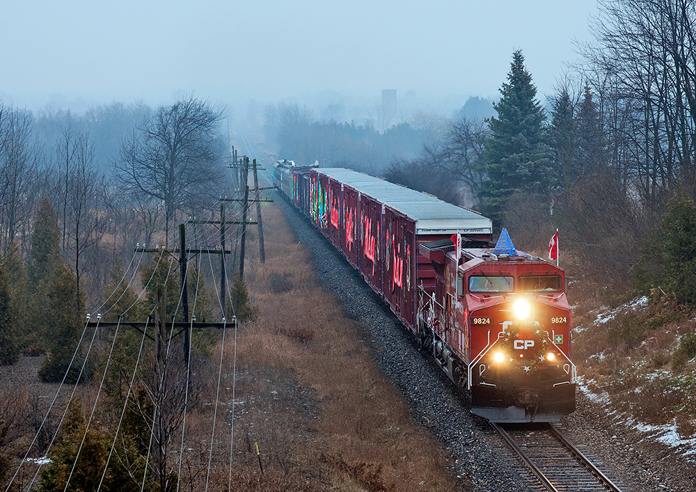 Talk about timing, the CP Holiday Train slows to a stop at Puslinch before taking the siding to meet CP 240.