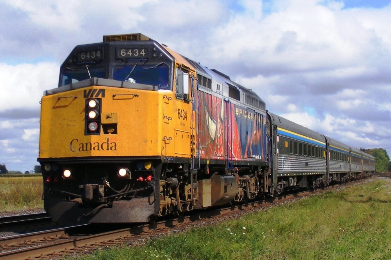 Westbound Via speeds through Princeton on its way to Windsor hauled by 6434 in Spiderman logo.