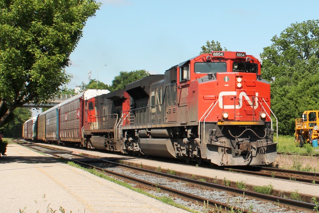 10:39 sees the train power east up the incline through Woodstock station.