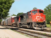 10:39 sees the train power east up the incline through Woodstock station.