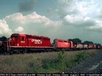 CP 5612, in fresh "Dual Flags" paint, leads train #503 as it pauses at Windsor South for the signal to drop down into the tunnel to Detroit.  Along for the ride today are Bangor and Aroostook dual-control GP38's #93 and #96 as well as a brand new Dr. Pepper trailer coming out of Montreal.  You just never knew what you might see at "The Hub".....