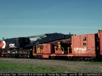 Railroading isn't all roses, especially if you need one of these!!  Here the crane and tender from CP's Thunder Bay auxiliary train sit patiently waiting for their next assignment.  Let's hope they weren't needed!!