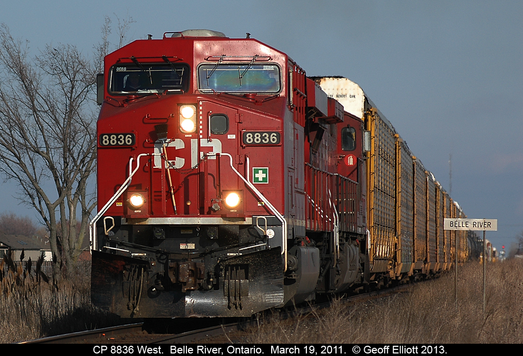 With the eastbound signal at Belle River siding showing in the background, CP 8836 west high-balls past the 'Belle River' mileboard on it's way to Windsor.