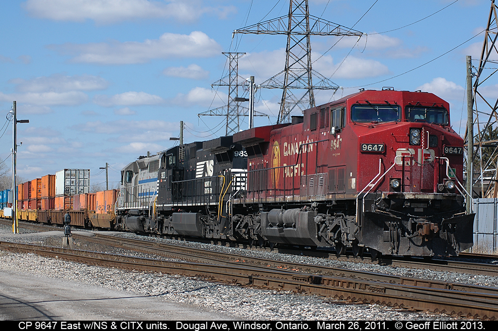 CP 9647 east has some assistance from an NS C44-9W and a CITX SD40 today as it waits on a crew before departing Windsor for points east.