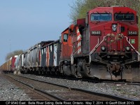 It's a nice hot May day, and CP 9540 and an SD40-2 sit quietly in the siding in Belle River, Ontario waiting for a new crew to take the train east to London, Ontario and beyond.