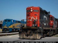 In a scene that can no longer be duplicated, passengers from VIA #73 are preparing to disembark their train after arriving from Toronto on VIA #73.  At the same time the CN Windsor local, with CN 7069 and 7230, pull by on their way to switch Hiram Walkers.  CN no longer performs this work as the Essex Terminal Railway now has the switching contract.  As well, the old Walkerville station behind VIA #914 has been razed and a new station built a little bit east of this location.  Amazing how quickly things can change.