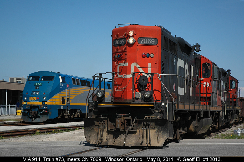 In a scene that can no longer be duplicated, passengers from VIA #73 are preparing to disembark their train after arriving from Toronto on VIA #73.  At the same time the CN Windsor local, with CN 7069 and 7230, pull by on their way to switch Hiram Walkers.  CN no longer performs this work as the Essex Terminal Railway now has the switching contract.  As well, the old Walkerville station behind VIA #914 has been razed and a new station built a little bit east of this location.  Amazing how quickly things can change.