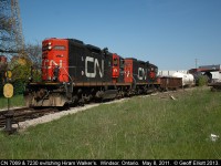 CN 7069 is paired with CN 7230 as they pull a string of loaded tanks from the Hiram Walker's tank loading facility.  The tracks that the local is on are now gone and CN no longer switches the plant as that duty has been transferred to the Essex Terminal Railroad.  A new track arrangement has been installed to allow the ETR easier access to switch the tank farm.