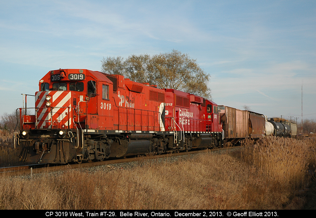 CP 3019 is laying on the horn @ West Belle River road as some redneck blew threw the crossing in his pick'm-up truck.  T-29 was accelerating fast out of town after meeting an eastbound that was waiting in the siding for them and 641 to pass.