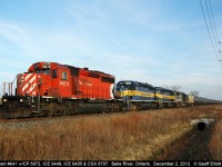 As the good light starts to fade CP 641-088 heads west past the Belle River mileboard at Rourke Line, led by CP 5872, ICE 6448, ICE 6405 & CSXT SD60 8707.