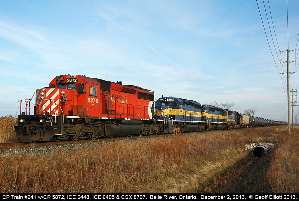 As the good light starts to fade CP 641-088 heads west past the Belle River mileboard at Rourke Line, led by CP 5872, ICE 6448, ICE 6405 & CSXT SD60 8707.