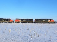 CN 401 passes amid the snow covered corn fields.