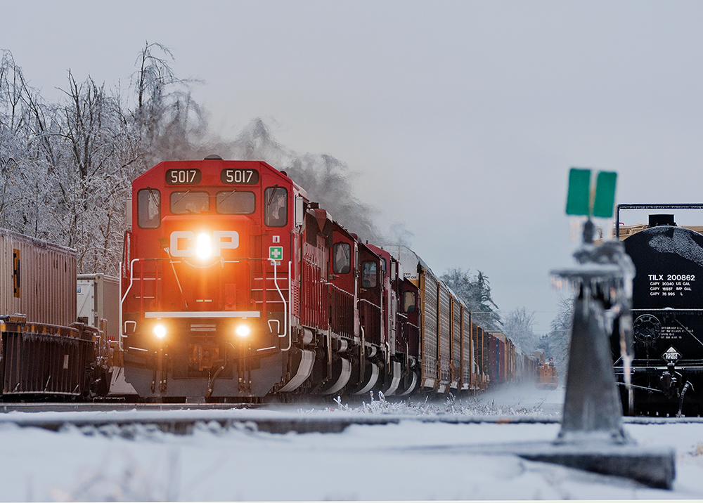 Caught up behind train 254 in last nights ice storm fiasco, CP 242 is seen blasting off with a nice lash up to Toronto after cleaning out a switch at Guelph Jct.