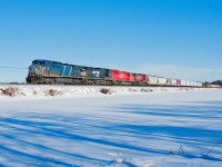 After setting off a car at Hornby with hot wheel problems due to a broken slack adjuster, this stellar lash up on CP 243 crosses the Mountsberg causeway on this cold winters day.