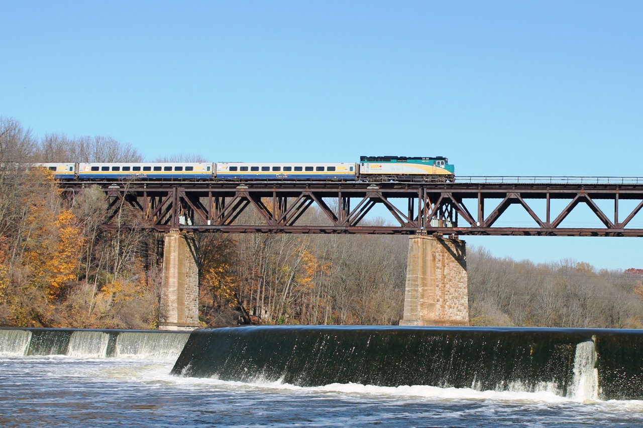 Eastbound Via 6427 and LRC coaches crosses Paris Viaduct. Seen from the east bank of the Grand river near the abandoned Mill Race.