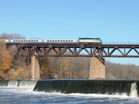 Eastbound Via 6427 and LRC coaches crosses Paris Viaduct. Seen from the east bank of the Grand river near the abandoned Mill Race.