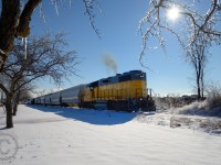 <b>Christmas eve has arrived</b> and I was given a couple early presents: Work let us out early - and mother nature gifted me sunshine. Among the glistening ice-covered trees, LLPX 2236 lets out a puff of exhaust as it limbers to work Guelph.