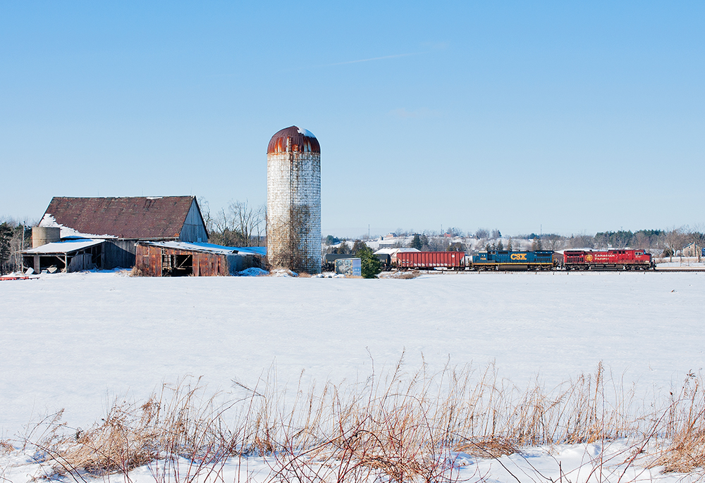 Foreign power is alive and well in Southern Ontario, CP 608 rolls through the countryside with a CSX C40-8 second trailing.