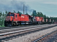 Unique Unit<br><br>CP had their share of one of kinds, such as<br><br>RSD 17  <br><br>see:   <a href="http://www.railpictures.ca/?attachment_id=6317">  8921 </a> <br><br><br>Here, the one of a kind MLW M640 #4744 is paired up with M630 #4501 on a CP Rail  extra West leaving Agincourt. <br><br>July 1975 Kodachrome by S.Danko<br><br>What's interesting:  in the seventies CP Rail sponsored CFL Football and in one TV commercial the 4744 was the star !<br><br>In 1984 CP Rail commenced  testing  4744 with AC traction motors on A-1-A trucks right through to 1992 retirement.<br><br>more Unique Units<br><br>two 3100's:<a href="http://www.railpictures.ca/?attachment_id=6648">  Northern Type  </a> <br><br>three EMD E-8 the 1800's:<a href="http://www.railpictures.ca/?attachment_id=8610">  ex CP </a> <br><br>M640: <a href="http://www.railpictures.ca/?attachment_id=1759">  the big M </a> <br><br>two of kind:  <a href="http://www.railpictures.ca/?attachment_id=9490">  CP GP 30 </a> <br><br>unique for 2004: <a href="http://www.railpictures.ca/?attachment_id=8188">  H 1 b </a><br><br>unique for 1978: <a href="http://www.railpictures.ca/?attachment_id=8348">  H 1 e </a><br><br>unique for 1975: <a href="http://www.railpictures.ca/?attachment_id=12181">  D 10 h </a><br><br>two unique units for 1976: <a href="http://www.railpictures.ca/?attachment_id=12256">  only on CP </a><br><br>other unique units?