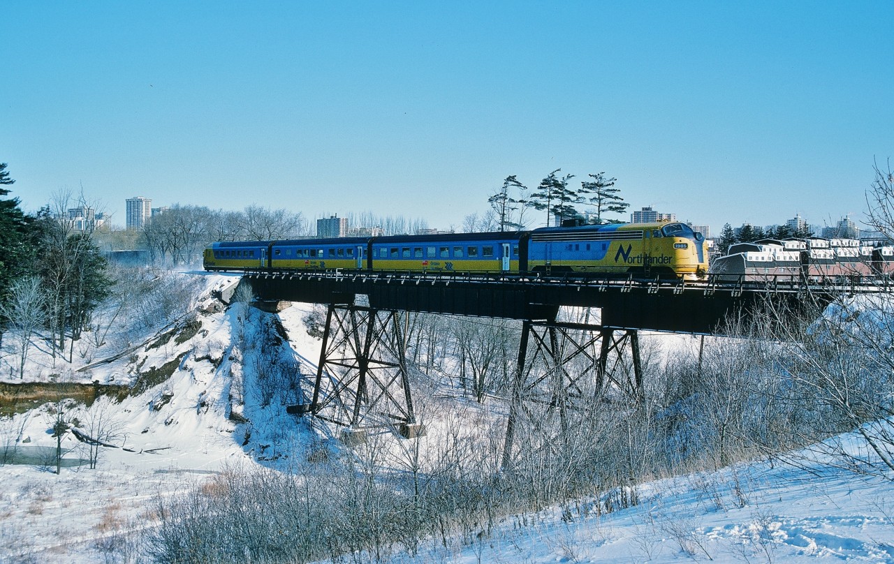 Saturday only unnamed ONR train 120;   originated North Bay - NOT the Northlander;   is on the East Branch Don River (one of many)  bridge approach CN Oriole.


 Northlander power unit #1985 is the former ONR FP7A #1518 and was scrapped in year 2000.


ONR trains 121 & 122 (the Northlander) operated daily except Saturday and train 123 operated Friday and Sunday only hence train 120 is effectively a move to enable Sunday ONR train 123 to operate with ONR equipment.


That being said, with passenger service to the North discontinued September 2012, note that a Provincial election is looming within the next year (2014 / early 2015 at the latest) and please do make the effort to communicate – by whatever means -  to all candidates' in YOUR riding your opinion(s) regarding ONR passenger train service !


Jan 26, 1985 Kodachrome by S. Danko.


More Northlander: 

 at CN Nipissing  


 multiple classics