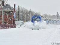 <B><I>SPLAT!</I></B> In the snowstorm, the first train of the day on the CP Westmount Subdivision, AMT #60 with an ALP-45DP in lead, smash the snow as it pass Montreal West tower.
