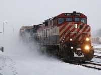 382 with BCOL 4642 - GTW 5940 and 126 kick up the fresh powder as they pass through Brantford