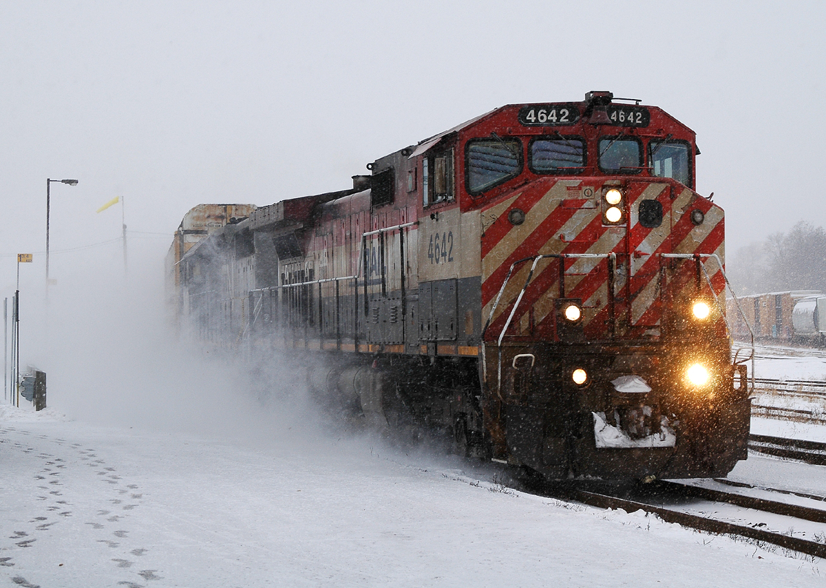 382 with BCOL 4642 - GTW 5940 and 126 kick up the fresh powder as they pass through Brantford