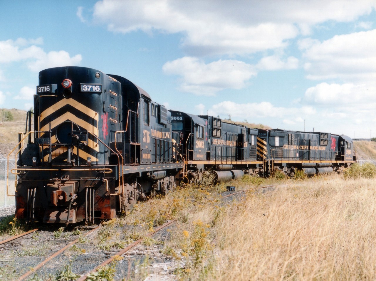 Three of the CBNS 'old guard' in the deadline at Sydney's main RR yard represents a dismal sight. The 3 former CN units, as well as any of the other old alcos that toiled on the CBNS, are all gone from the property now, these being sold to locomotive dealer Ed Bowers in 2003. Of the 3716, 2003 and 2016; the CTG lists 3716 as the only one not scrapped. But where is it??
