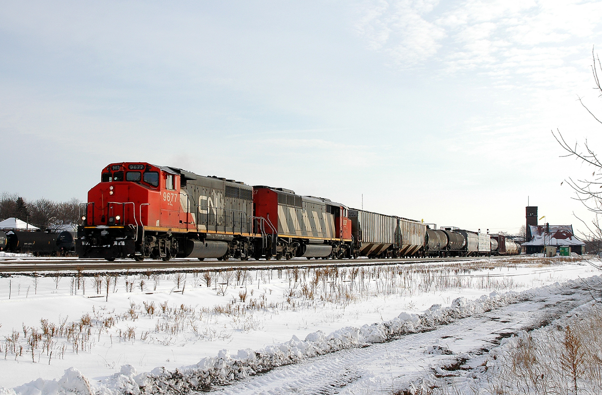 CN 9677 (Former GO Transit 710) and CN 5527 provide the power for a 60 car 385 as it is passing the west end of the Yard.
