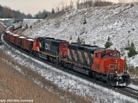 I had two choices on this day; shoot the CP 420 that Michael Delic has posted at Beeton, or go after CN X371 with an SD40-2W leading. Hmmm. Easy choice, X371 was a lot closer to home and I haven't shot an SD40-2W leading in a few years. So I wound up shooting this train at four locations, including one of my favourite haunts, here at Beare, where they're into the ruling grade for westbound freights between Montreal and Toronto. It not a pair of GP9's, but the 5348 and 5723 still sounded great lifting X371 up the hill. 1345hrs.