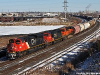 A late running 309 flies through Whitby behind CN 8909, 5642, BNSF 6584, and DPU CN 8954. They must have been trying to make back some time on what is normally nocturnal train through these parts, as the detector about a mile or so west read 61mph. As seems typical in railroading, the BNSF unit is an A-1-A trucked speedster intended for use on the successors to the old ATSF 199/991 trains, so of course it has managed to find it's way onto a CN freight. 1231hrs.