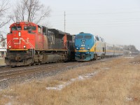 CN 8865 leads CN 331 (I believe) westward at Princeton as VIA 73 speeds by on the south track.