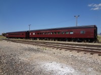 Only minutes out of the car shop and filling the air with the smell of fresh paint, ex-Amtrak day coaches, now numbered CP 103 and CP 104 are positioned on the shop lead to be picked up shortly by a lone yard switcher and taken to points unknown.