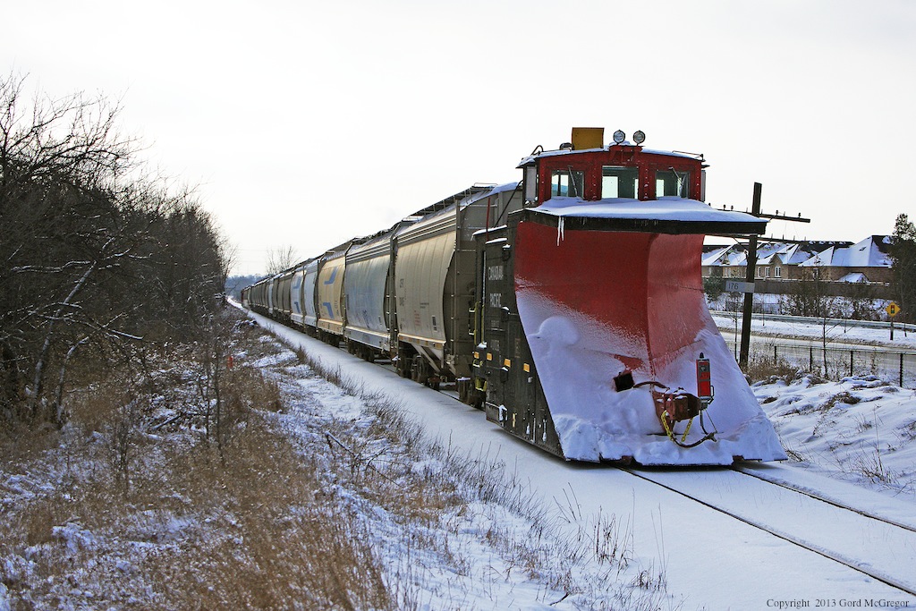 With a longer winter ahead CP 401028 a Russell style plow is hauled to Toronto Yard possibly for service on T07.