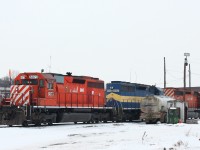 As the old adage says, good power and bad weather always seem to go together. But, I’m not complaining, it’s been a while since I've seen a lash-up like this on CP, it’s usually a pair of toasters heading up anything in the area that I've seen. The lead unit, 6073,  and the trailing unit, 5906 (from the photographers prospective) have returned to their birthplace still in service for their original owner for 46 years and 35 years respectively. Sandwiched in the middle is ex. DM&E 6052, originally built for Union Pacific at EMD’s La Grange shops 42 years ago. Than rebuilt to dash 3 status and sold to DM&E 17 years ago and given the blue and yellow appearance with the added distinction “City of Crawford”, which (as seen here) it still wears today, even after the DM&E was acquired by CP in 2008. 