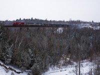 6239-DME6370-DME6359 are the power on 643 as it rolls through a snow covered Cherrywood.