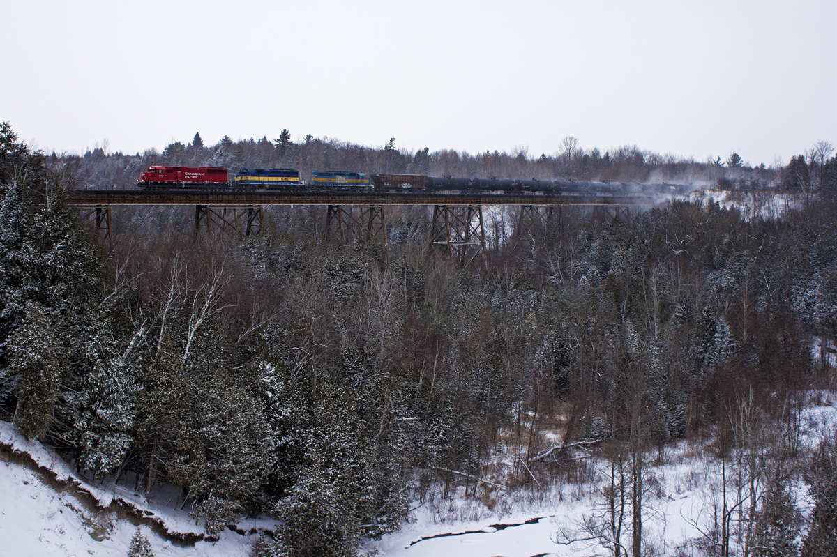 6239-DME6370-DME6359 are the power on 643 as it rolls through a snow covered Cherrywood.