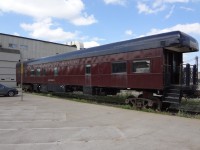 CP business car Assiniboine is 'up on stilts' so-to-speak as it waits outside the Ogden Yard car shop for its rebuilt truck assemblies. The relatively fresh exterior paint is already showing signs of pollution stains and will require a good wash before the car goes back into service and receives its first load of executives.
The Ogden car shops were catering to at least half-a-dozen business cars in various stages of overhaul during my July 2012 visit.
