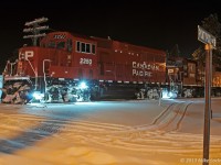 The usual brief stop in town to grab a hot coffee allows for a few time exposures of CP 2250. The snowmobilers go about their business unimpressed by the passage of T07, making good use of the early, deep snowfall up here on the moraine. CP 2250, 3105, 2254, and 8206 lead 24 cars. 1916hrs.