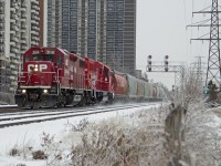 A winter wonderland CP T14 with CP 3114, CP 2251 with 9 cars in tow dash through the snow headed for Streetsville.